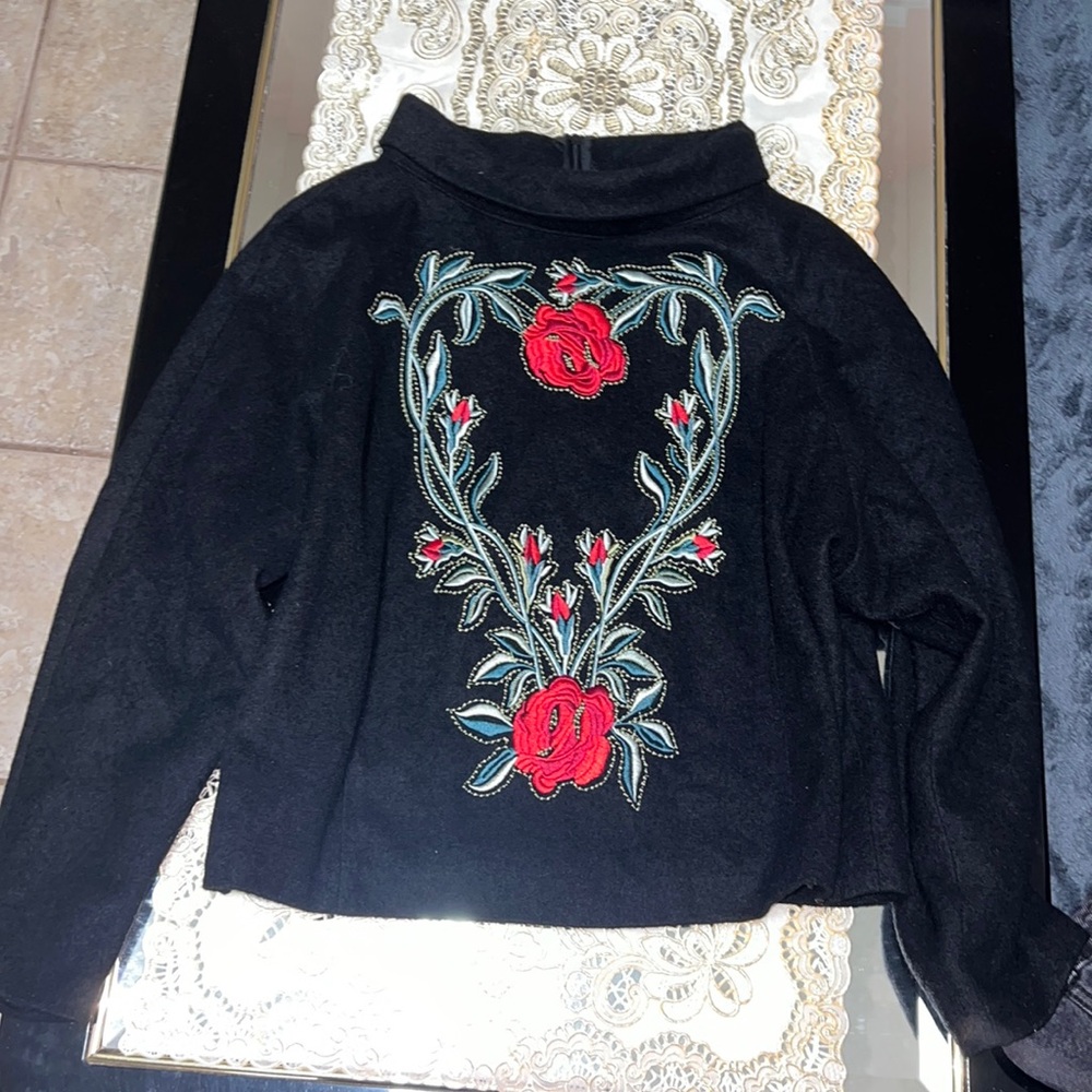 Black wool and cotton blend high neck sweater with floral embroidery